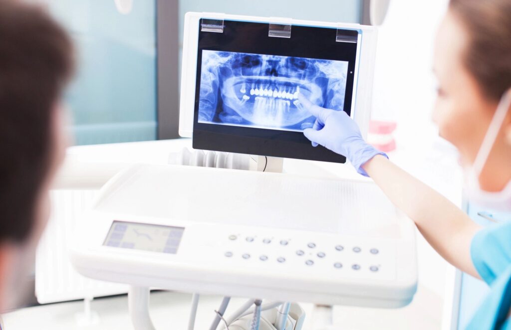 dentist reviewing a patients dental imaging