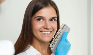 Female dental patient with cosmetic dentist in Huntington Bay on Long Island