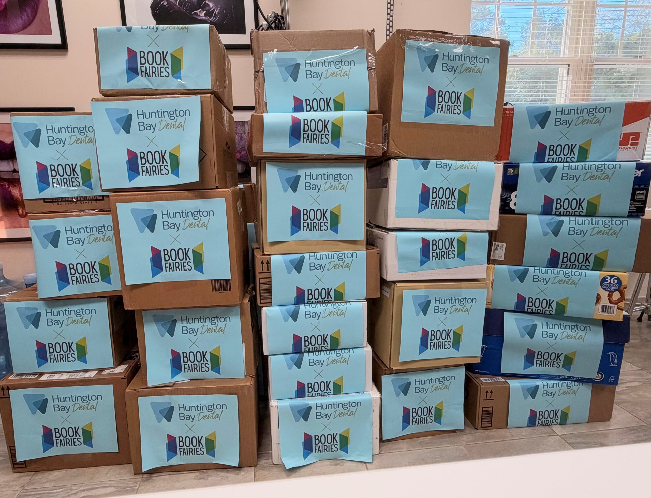 Boxes of donated books at Huntington Bay Dental